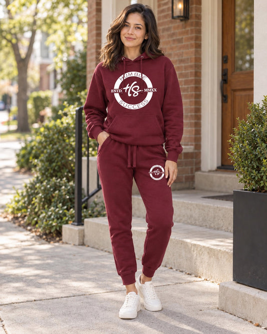 Model wearing the Humble Success burgundy Signature Series hoodie and joggers